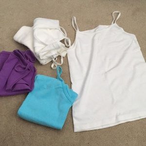 5 tank tops in total.3 white,1 purple,and 1 blue.